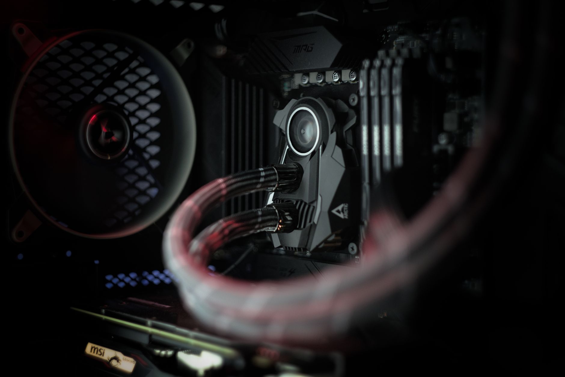 Detailed view of a computer's cooling system showcasing advanced technology with illuminated components.