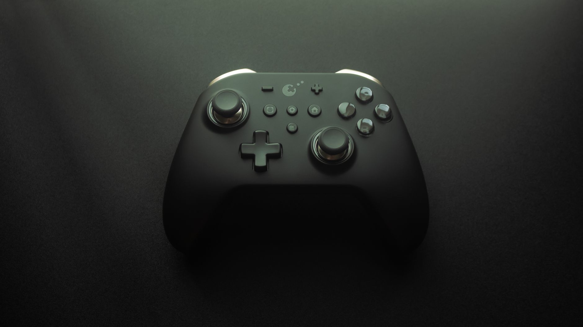 High-quality image of a modern game controller on a smooth black surface, highlighting design and technology.