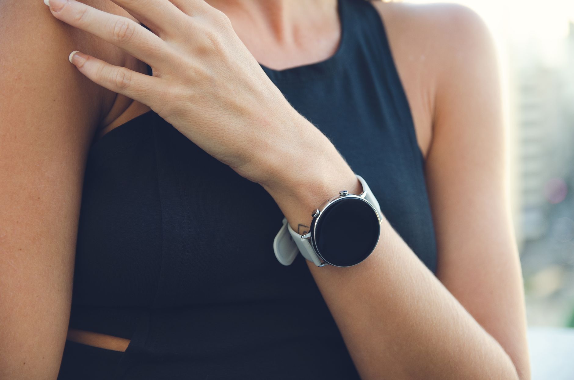 Close-up of a woman wearing a sleek smartwatch, ideal for tech-lifestyle imagery.