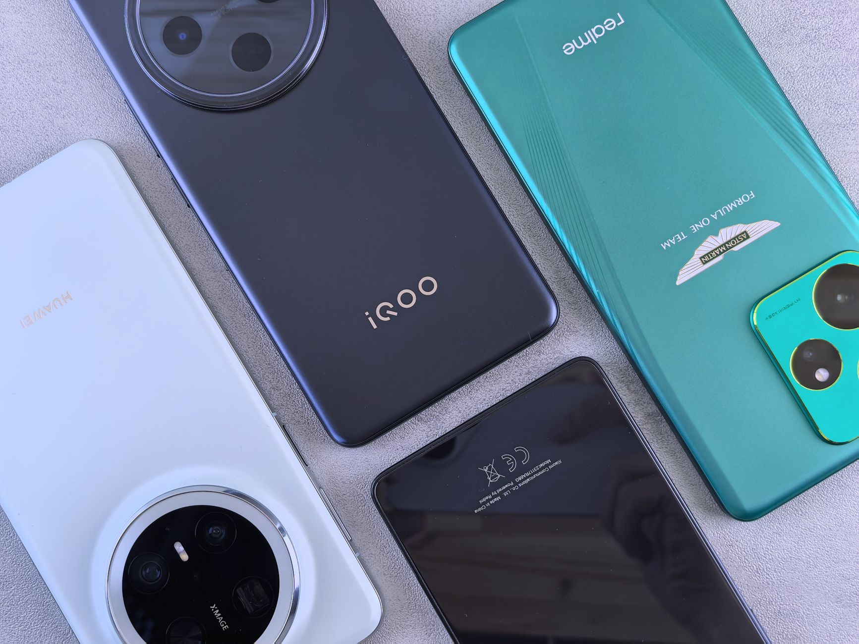 Stylish arrangement of different smartphone models in a flat lay composition showcasing diverse designs.